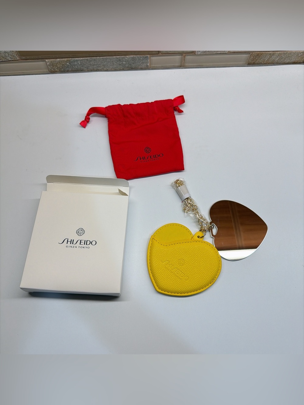 NIB Shiseido Yellow Heart Bag Charm Compact Mirror Keychain
